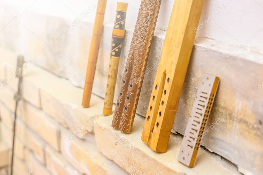 Traditional Serbian wooden frula on wall. Traditional Serbian music instrument.