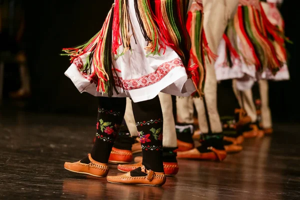 Young Serbian dancers in traditional costume. Folklore of Serbia.