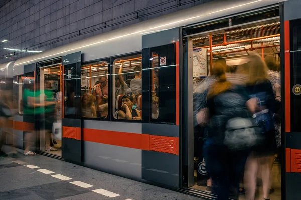 Prague, Czech Republic,23 July 2019; People at metro station entering subway train, long exposure technique for movement. Urban scene, city life, public transport and traffic concept. — Stock Photo, Image