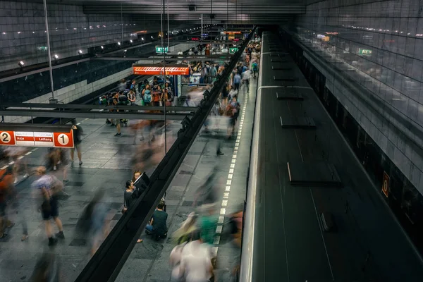 Prague, Czech Republic,23 July 2019; People at metro station entering subway train or walking by, long exposure technique for movement. Urban scene, city life, public transport and traffic concept. — Stock Photo, Image