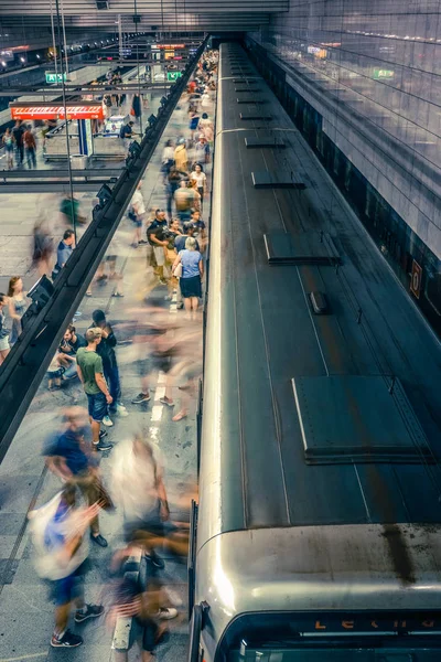 Prague, Czech Republic,23 July 2019; People at metro station entering subway train or walking by, long exposure technique for movement. Urban scene, city life, public transport and traffic concept. — Stock Photo, Image