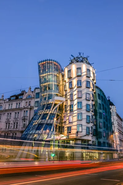 The Dancing House or Fred and Ginger building in Prague. Long exposure night scene of building with car light trail. — Stock Photo, Image