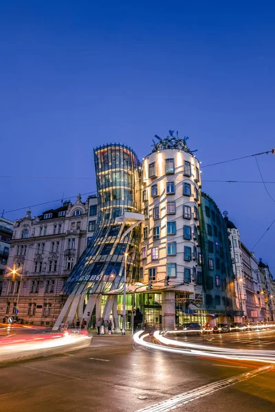 The Dancing House or Fred and Ginger building in Prague. Long exposure night scene of building with car light trail. — Stock Photo, Image