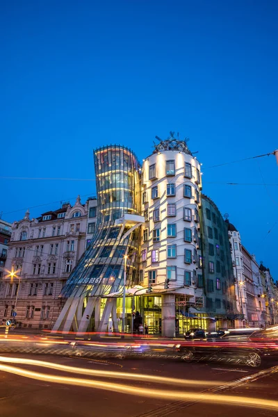 The Dancing House or Fred and Ginger building in Prague. Long exposure night scene of building with car light trail. — Stock Photo, Image