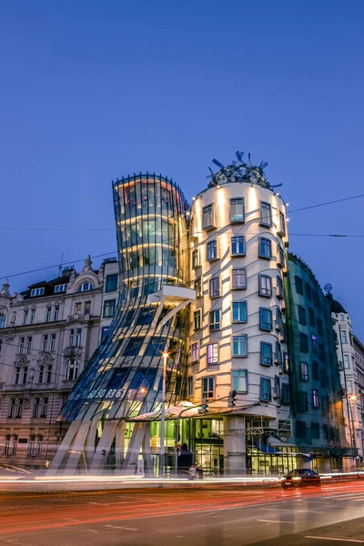 The Dancing House or Fred and Ginger building in Prague. Long exposure night scene of building with car light trail. — Stock Photo, Image