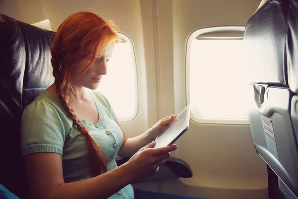 woman in the chair on board aircraft