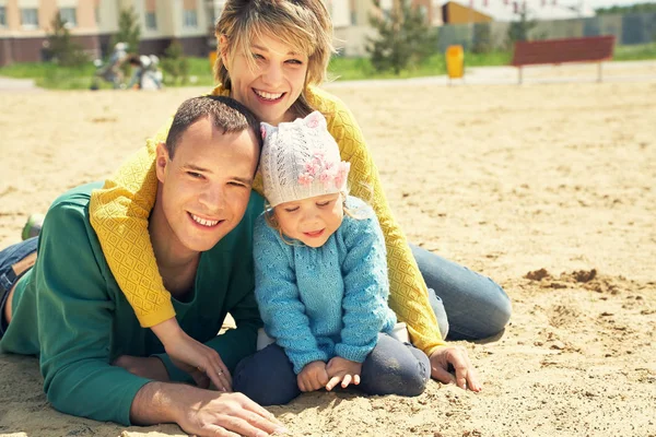 Happy playing family outdoors — Stock Photo, Image