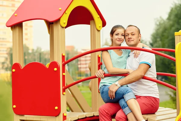 Young happy couple in love outdoors in a summer park — Stock Photo, Image