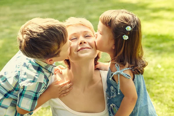 Playful family outdoors. mom with children in the summer. Mother and kids — Stock Photo, Image