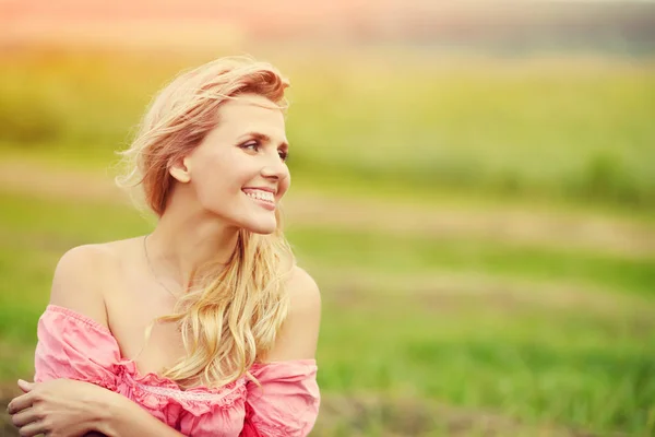 Outdoor portrait of a beautiful middle aged blonde woman — Stock Photo, Image