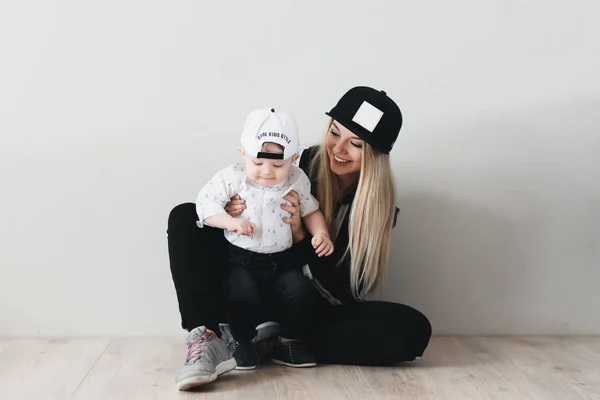 Stylish Young Mom Cap Watching Her Cute Year Old Baby — стоковое фото