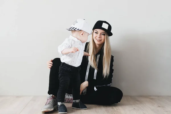 Stylish Young Mom Cap Watching Her Cute Year Old Baby — стоковое фото