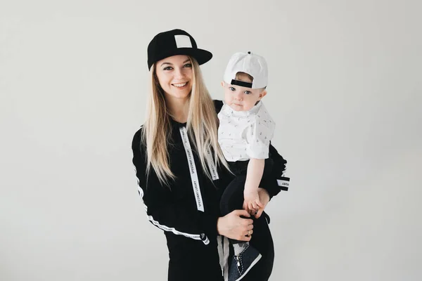 Stylish Young Mom Cap Holding Her Cute One Year Old — Stock Photo, Image