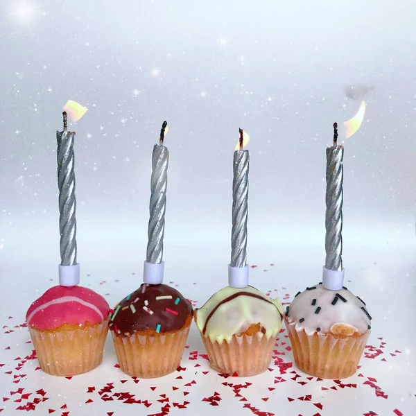Happy birthday background - birthday cupcake with burning candle. Holidays greeting card