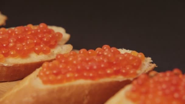 Sandwich with red caviar 007 / Red caviar smeared on white bread with butter — Stock Footage Sandwich Red Caviar 007 Red Caviar Smeared White Bread Butter Video Clip