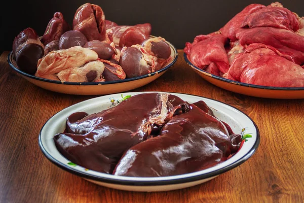 Spread out in bowls, washed, pig insides after cutting — Stock Image Spread out in bowls, washed, pig insides after cutting Stock Image