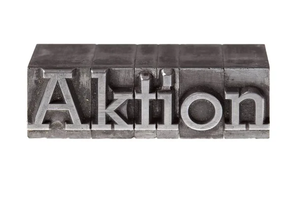 Letterpress Iron Lead Letters Forming German Word Action — Stock Photo, Image