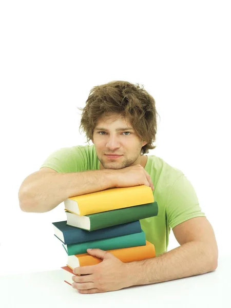 Giovane Studente Maschio Con Pila Libri Colorati — Foto Stock