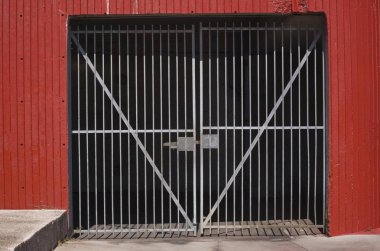 Garage entrance with a steel gate, Montral, Quebec Province, Canada, North America  clipart