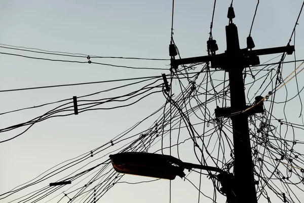 High voltage power line and tangled cables, Madurai, Tamil Nadu, India, Asia