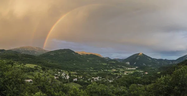 Panorama with rainbow after thunderstorm over the valley of Castellane, Alpes-de-Haute-Provence, Provence-Alpes-Cte d\'Azur, France, Europe