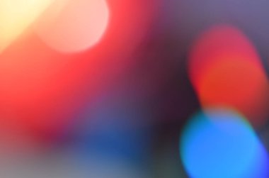 Glitter, defocused ile Cd disk üzerindeki lamba ışığında alınan doğal soyut renkli bokeh arka plan