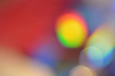 Glitter, defocused ile Cd disk üzerindeki lamba ışığında alınan doğal soyut renkli bokeh arka plan