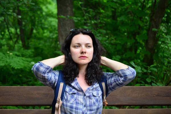 Traveling woman looking into the distance, outdoors. Girl thinking how to hike