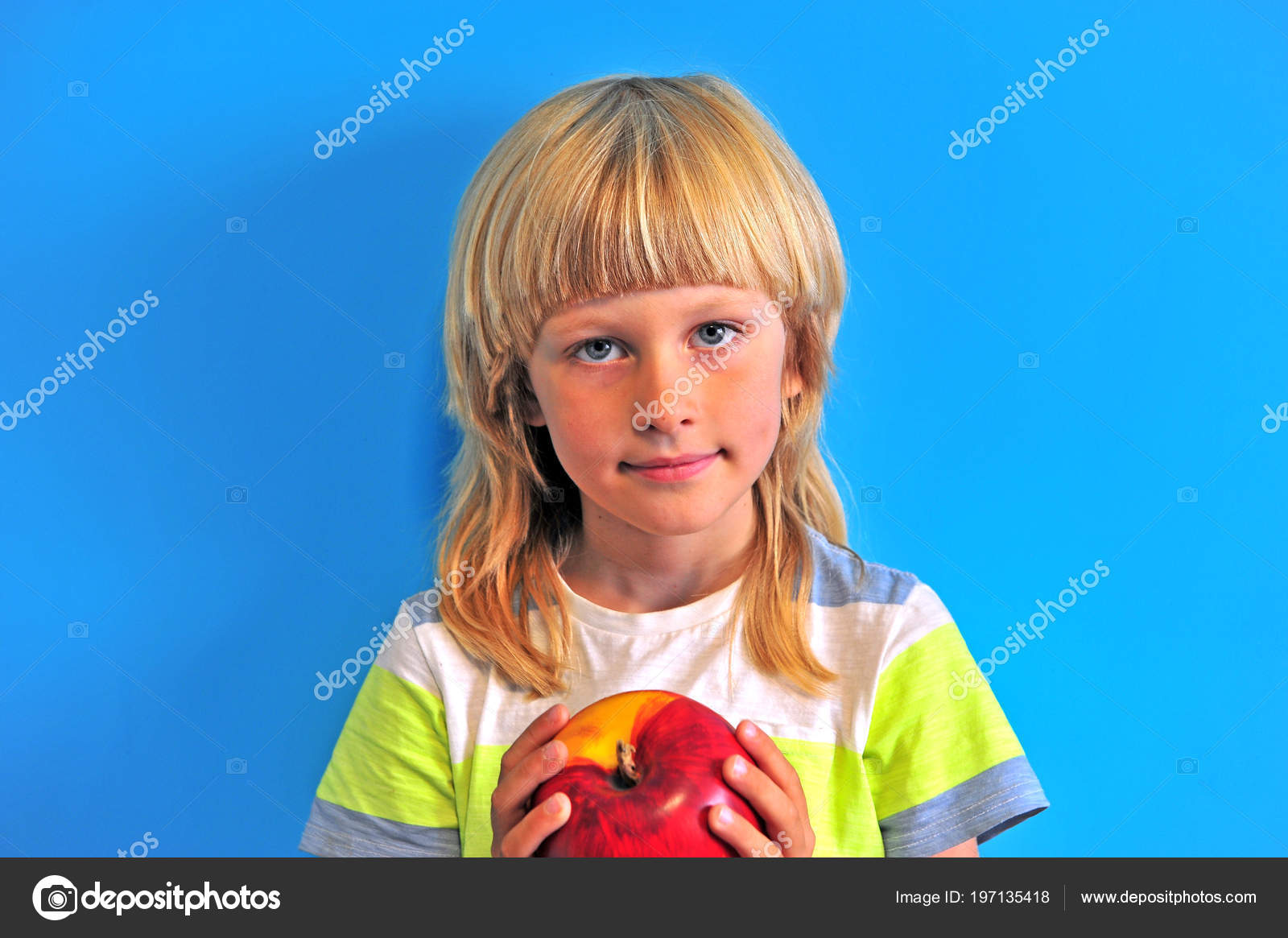Long Blonde Hair Boy Holding Apple Blue Background Stock Photo