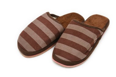 Evde beyaz izole arka plan üzerinde kullanılan terlik. Spor Ayakkabı