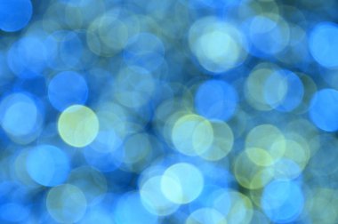 Mavi, sarı, mavi, yeşil renkli arka plan ile Noel ve yeni yıl için bokeh