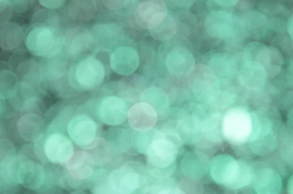 Turquoise colored abstract background with bokeh, for the new year and christmas