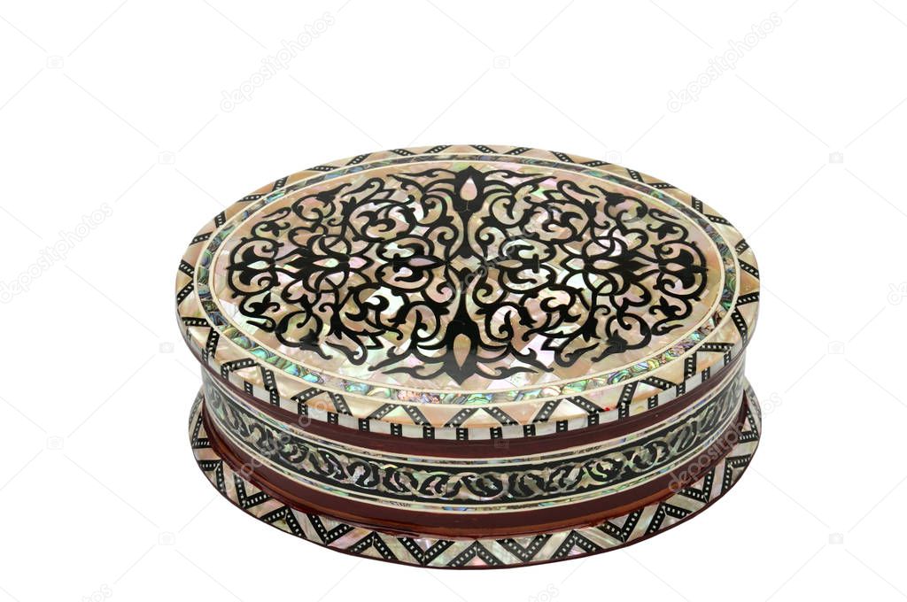 Wooden box with ornaments for jewelry and bijoux on a white back