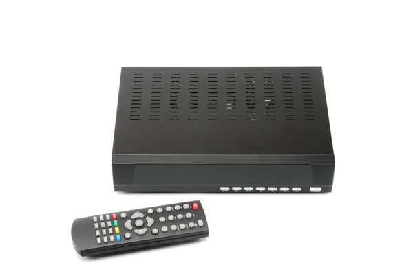 Digital TV tuner with remote control on white background — Stock Photo, Image