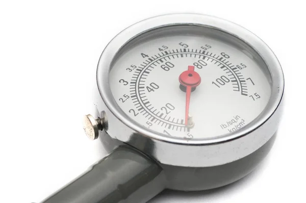 Pressure gauge for measuring air pressure in car tires on a whit — Stock Photo, Image