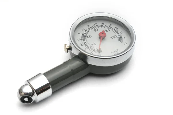 Pressure gauge for measuring air pressure in car tires on a whit — Stock Photo, Image