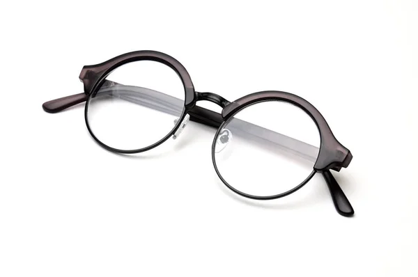 Optiska glasögon på en vit bakgrund. — Stockfoto