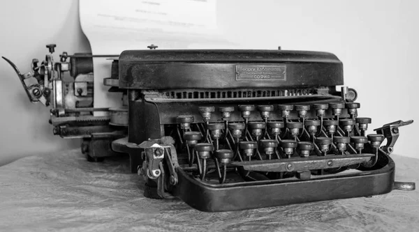 Close up of an old typing machine with cyrillic letter buttons