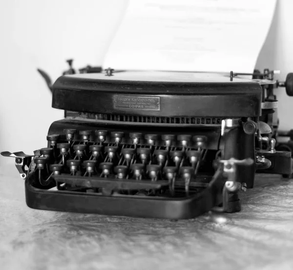 Close up of an old typing machine with cyrillic letter buttons