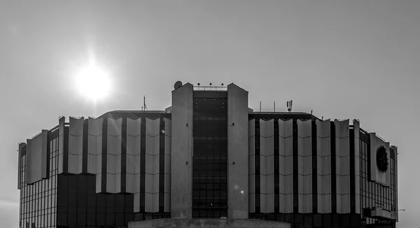 Sunbeams on a dark sky over National Palace of Culture, Sofia, Bulgaria