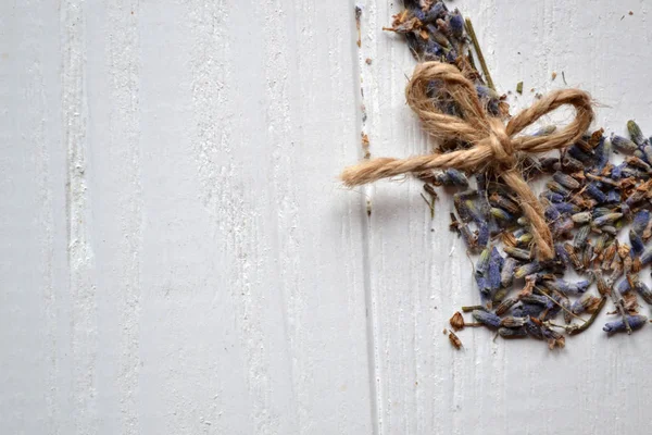 Lavender flavor. Dried lavender flowers on the white wooden table.