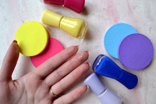 Bright color palette. Trendy bright color. Creative layout made of nail polish and bright sponges.