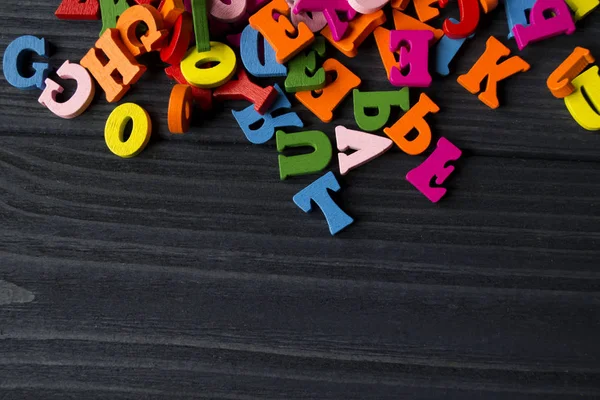 Letras Multicoloridas Fundo Madeira Azul Escuro Alfabeto Madeira Colorido Uma — Fotografia de Stock