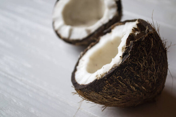 Coconut on a white wooden background.