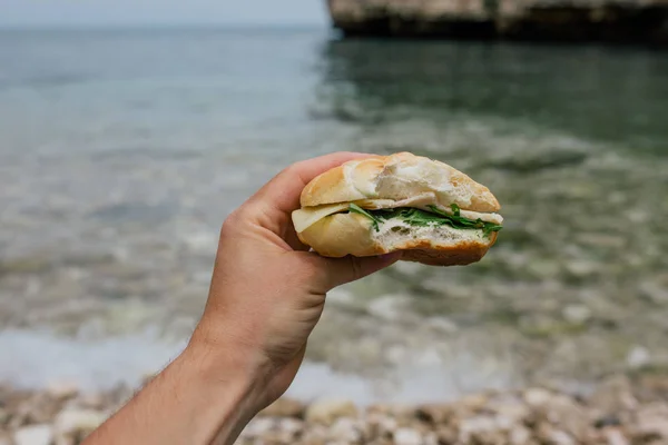 Hamburger it the hand in Polignano a Mare apulia Italy — Stock Photo, Image