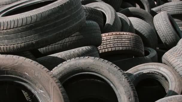 Old rubber wheels for trash factory recycling — Stock Video
