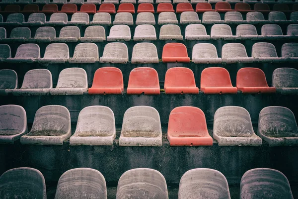 Old empty chairs seats in the stadium arena in Georgia