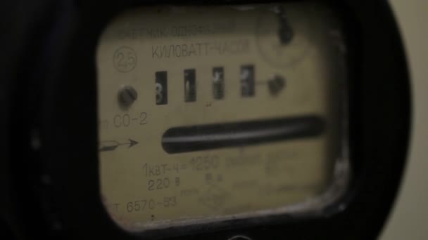 Old Soviet mechanical electricity meter on a yellow wall — Stock Video