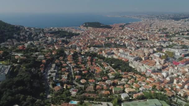 The city of Nice in the south of France on the azure coast is a view from above on the roofs of houses and roads — Stock Video