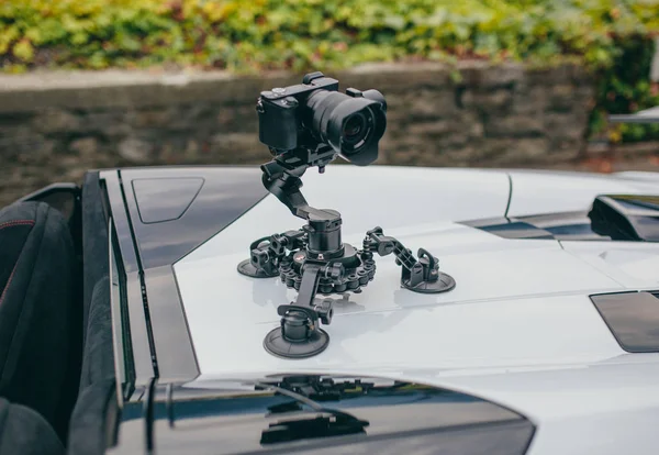 Camera gimbal on the car steadicam keeps on suckers on the auto car — Stock Photo, Image